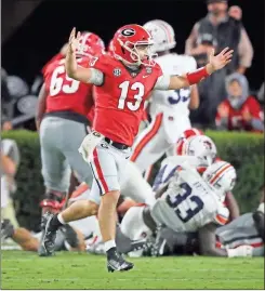  ?? AP-curtis compton ?? Georgia quarterbac­k Stetson Bennett celebrates a touchdown run by Zamir White against Auburn on Saturday.