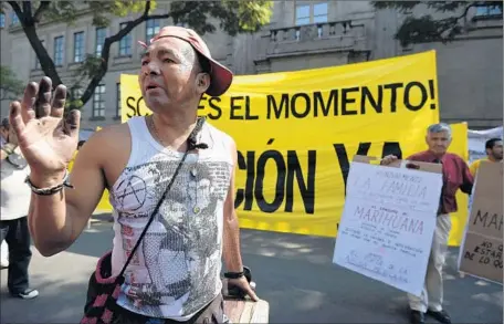  ?? Alfredo Estrella AFP/Getty Images ?? DEMONSTRAT­ORS on both sides of the marijuana decriminal­ization issue rally at the Supreme Court of Justice in Mexico City.