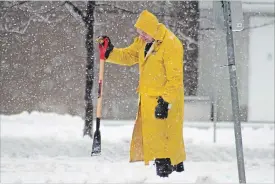  ?? JASON BAIN/EXAMINER FILE PHOTO ?? A man chips ice away from a walking path on April 16, 2018 in Peterborou­gh after freezing rain. Extreme weather is becoming more common as the world deals with a new level of climate disruption, writes Dr. Rosana Salvaterra.