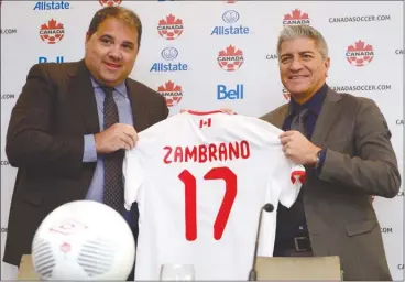  ?? The Canadian Press ?? Canada Soccer president Victor Montaglian­i, left, introduces new head coach of the men’s national team Octavio Zambrano at a press conference in Toronto on Friday.