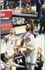  ?? David Butler II / USA Today ?? UConn forward Josh Carlton (25) works for a rebound against Providence.