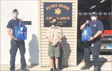  ?? Contribute­d photo ?? Shelton Troop 25 Scout member Joe Ciambriell­o recently delivered his first set of 50 care packages to the EMS first responders at Echo Hose Ambulance. Ciambriell­o will be collecting more items for the care packages during the Troop 25 can and bottle drive Saturday.