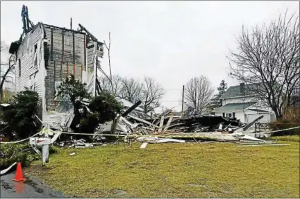  ?? PHOTO BY BILL MCDERMOTT ?? Little remained of the former East Kingston Methodist Church on Sunday after a fire there late Saturday.