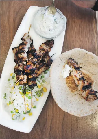  ?? ATCO BLUE FLAME KITCHEN ?? These pork souvlaki pitas served with tzatziki will be a hit this barbecue season.