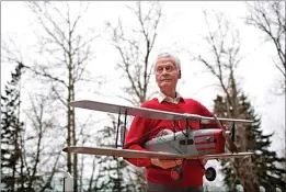  ?? CP FILE PHOTO ?? Max Ward is pictured with a model of his first plane, the De Havilland Fox Moth CF-DJB, in Edmonton in this November 2015 file photo. Ward, an aviation pioneer who went from bush planes to internatio­nal charters, has died.