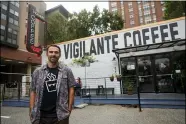  ?? JULIO CORTEZ — THE ASSOCIATED PRESS ?? Chris Vigilante poses in front of one of his coffee shops, Sept. 1in College Park, Md.