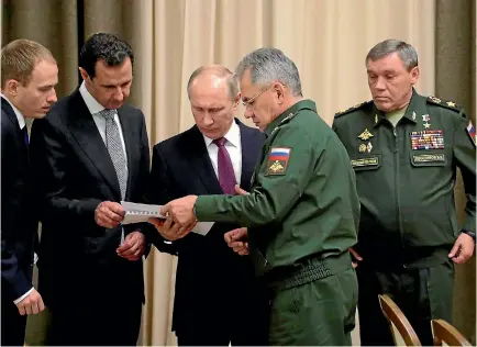  ?? PHOTO: REUTERS ?? Syrian President Bashar al-Assad meets with Russian President Vladimir Putin, Russian Defence Minister Sergei Shoigu, second from right, and Chief of the General Staff of Russian Armed Forces Valery Gerasimov, right, in the Black Sea resort of Sochi....