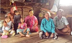  ??  ?? Sukarno with his wife, son, daughter-in-law and three grandchild­ren living in the tiny home.