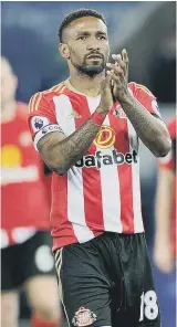  ??  ?? Agony: Darron Gibson (left) suffers at the final whistle, while Jermain Defoe applauds the travelling fans.