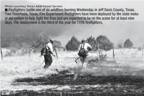  ?? Photo courtesy Texas A&M Forest Service ?? ■ Firefighte­rs battle one of six wildfires burning Wednesday in Jeff Davis County, Texas. Two Texarkana, Texas, Fire Department firefighte­rs have been deployed by the state mutual aid system to help fight the fires and are expected to be on the scene...