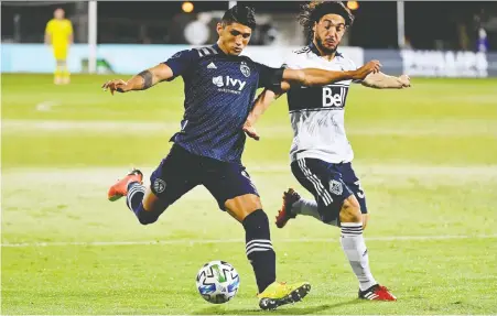  ?? JASEN VINLOVE/USA TODAY ?? Sporting KC forward Alan Pulido controls the ball around Whitecaps midfielder Russell Teibert at the ESPN Wide World of Sports Complex near Orlando last month. The Caps are uncertain of what happens after they play home-and-away sets against Montreal and Toronto.