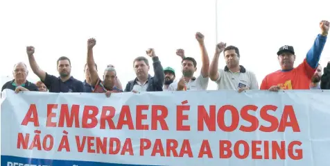  ?? — Reuters ?? Employees of Embraer protest against the company sale to Boeing in Sao Jose dos Campos, Brazil.