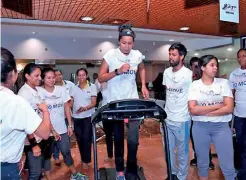  ??  ?? Sri Lanka National Netball team member Darshika Abeywickra­ma completes 10,000 steps at the HNB FIT launch