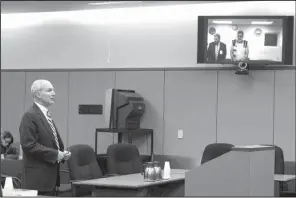  ?? AP/MARK REIS ?? Fourth Judicial District Attorney Dan May speaks Monday in Colorado Springs, Colo., during the first court appearance for Robert Lewis Dear, the suspect in shootings at the Colorado Springs Planned Parenthood. Dear, who appeared via video, faces...