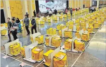  ?? VINCENT THIAN
THE ASSOCIATED PRESS ?? Workers from the election commission do final checks on ballots which are to be sent out in Kuala Lumpur, Malaysia, Tuesday.