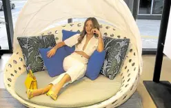  ?? ?? Sarah Lahbati lounging in the Canasta outdoor circular sofa designed by Patricia Urquiola