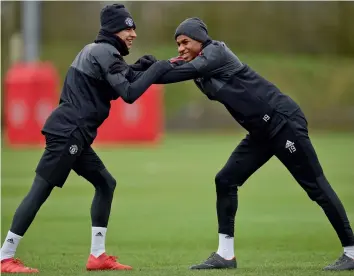  ?? AFP ?? Manchester United’s Jesse Lingard ( left) and Marcus Rashford at the club’s training complex near Carrington, on Monday, eve of their Champions League round of 16 second leg match against Sevilla. —