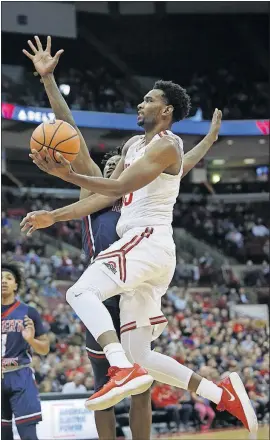  ?? THE ASSOCIATED PRESS] [PAUL VERNON/ ?? Keita Bates-Diop goes up for a shot against Robert Morris’ Koby Thomas. Diop scored 19 points and added 11 rebounds in the opener.