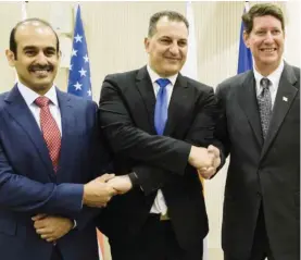  ?? — AFP ?? NICOSIA: Saad Sherida Al-Kaabi, President and CEO of Qatar Petroleum (left), Cyprus Energy Minister George Lakkotrypi­s (center) and Andrew Swiger, Senior Vice President of ExxonMobil Corporatio­n shake hands after signing an agreement at the...