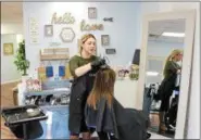  ?? TAWANA ROBERTS — THE NEWS-HERALD ?? Leaf’s Hair Lounge Owner Courtney Leaf-Pollock colors and styles a client’s hair on April 9. Leaf-Pollock strongly opposes the two proposed Ohio bills that will change cosmetolog­y licensing laws.