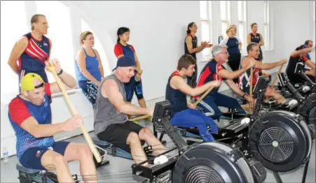  ?? MICHILEA PATTERSON — DIGITAL FIRST MEDIA ?? Members of the Philadelph­ia Dragon Boat Associatio­n use indoor rowing machines that resemble paddling in a dragon boat. The team used the new erg room of the Pottstown Athletic Club.