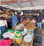  ?? AFP ?? libyans shop for vegetables during a curfew announced by the un-recognised Government of national Accord in tripoli on Sunday. —