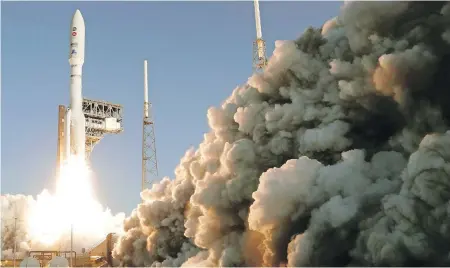  ??  ?? A United Launch Alliance Atlas V rocket lifts off from pad 41 at the Cape Canaveral Air Force Station on Thursday, in Cape Canaveral, Florida. The mission is sending a Mars rover to the red planet to search for signs of life among other objectives.