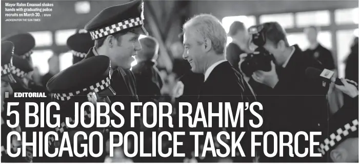  ?? | BRIAN
JACKSON/FOR THE SUN-TIMES ?? Mayor Rahm Emanuel shakes hands with graduating police recruits on March 30.