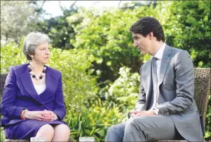  ?? CP PHOTO ?? Canadian Prime Minister Justin Trudeau meets with Britain’s Prime Minister Theresa May at 10 Downing Street in London Wednesday.