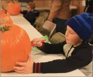  ?? MEDIANEWS GROUP FILE PHOTO ?? Pumpkin decorating and pumpkin carving events for kids are held in many Michigan communitie­s.