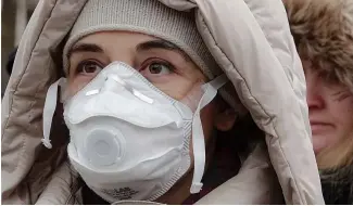  ?? ?? Woman wearing face mask takes part in a protest against air pollution, in Sarajevo, Bosnia, 20 January 2020.