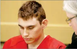  ?? ASSOCIATED PRESS ?? IN THIS FEB. 2018 FILE PHOTO, Nikolas Cruz, accused of murdering 17 people at Marjory Stoneman Douglas High School, appears in court for a status hearing in Fort Lauderdale, Fla. 3 arrested on gun charges suspected in bombing