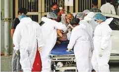  ?? Reuters ?? ■ A patient with breathing problem is rushed to a hospital for treatment in Ahmedabad, Gujarat, yesterday,