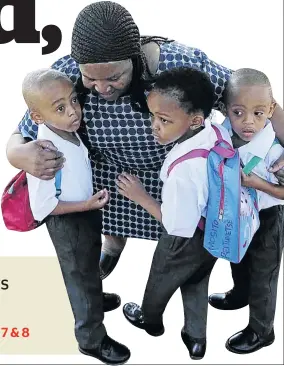  ?? / THULANI MBELE ?? Kgomotso Mosito hugs her triplets as they start their first day at school.