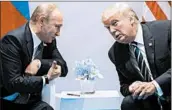  ?? EVAN VUCCI/AP 2017 ?? Presidents Vladimir Putin and Donald Trump met briefly, and amicably, last year during a conference in Germany.