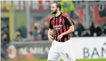  ?? Picture: AFP/MIGUEL MEDINA ?? LONG, LONELY WALK: AC Milan’s Gonzalo Higuain leaves the pitch after receiving a red card during the Italian Serie A match against Juventus.