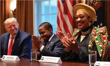  ?? Photograph: Nicholas Kamm/AFP via Getty Images ?? Donald Trump sits near Angela Stanton King during a meeting with African American leaders at the White House in February.