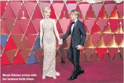  ??  ?? Nicole Kidman arrives with her husband Keith Urban.