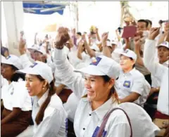  ?? PHA LINA ?? Party activists raise their hands in support as Kem Sokha speaks at a party meeting yesterday in Phnom Penh.