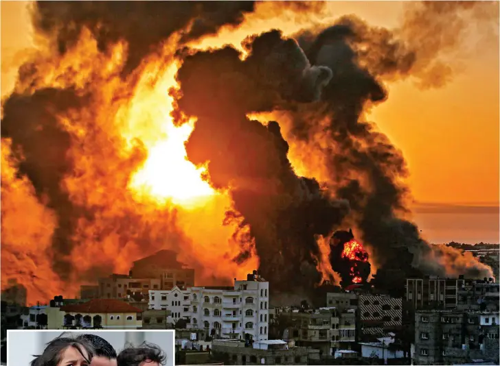  ??  ?? Firestorm: Buildings aflame against the sunrise in Gaza yesterday after Israeli airstrikes on Khan Yunis