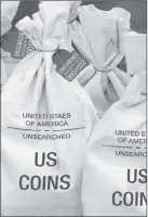  ??  ?? UNSEARCHED: Pictured above are the unsearched Vault Bags loaded with over 2 pounds of U. S. Gov’t issued coins some dating back to the 1800’ s being handed over to Colorado residents by Federated Mint.