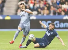  ?? GETTY IMAGES/FILES ?? New Whitecaps signee Luis Martins — then with Sporting KC — works against Vancouver's Jakob Nerwinsk in a 2020 game.