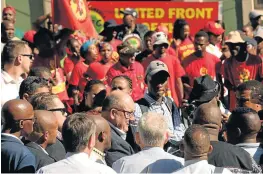  ?? Picture: FREDLIN ADRIAAN ?? TENSIONS HIGH: Athol Trollip addresses the media outside the Wool Board building. A council meeting for a vote of no confidence in mayor Mongameli Bobani was cancelled on security concerns.