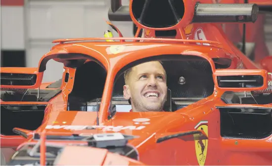  ?? Picture: Getty Images ?? RED ALERT. Ferrari driver Sebastian Vettel in his car in the team garage during preparatio­ns for this weekend’s German Grand Prix at Hockenheim.