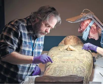  ?? Picture: Julie Howden/Perth Museum and Art Gallery/PA. ?? Conservato­rs discovered paintings inside the coffin of an Egyptian mummy after she was lifted out of it for the first time in more than 100 years.