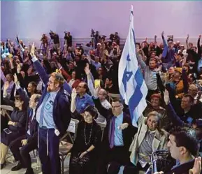  ?? REUTERS PIC ?? Likud party members voting during a Likud Central Committee meeting in Airport City, Israel, on Sunday.