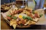  ??  ?? Papadum nachos Php 1,000–1,499
person PHP 500 (WINE) PHP 800 (LIQUOR)