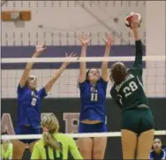  ?? MICHAEL REEVES — FOR DIGITAL FIRST MEDIA ?? Bishop Shanahan’s Michaela Devlin fires home a kill between Downingtow­n West’s Aly Reardon (11) and Hailey Lewis (6).