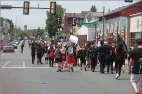  ?? JEN SAMUEL — MEDIANEWS GROUP ?? People march along Lincoln Highway to City Hall in Coatesvill­e for racial equality and criminal justice reform on June 4.