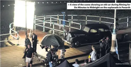  ?? Matthew Horwood ?? > A view of the scene showing an old car during filming for Six Minutes to Midnight on the esplanade in Penarth